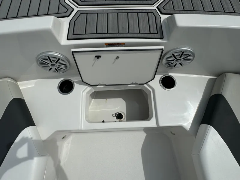 Slide: The Image of 2023 Starcraft SVX 171 OB boat interior with speakers and storage compartment. - 5