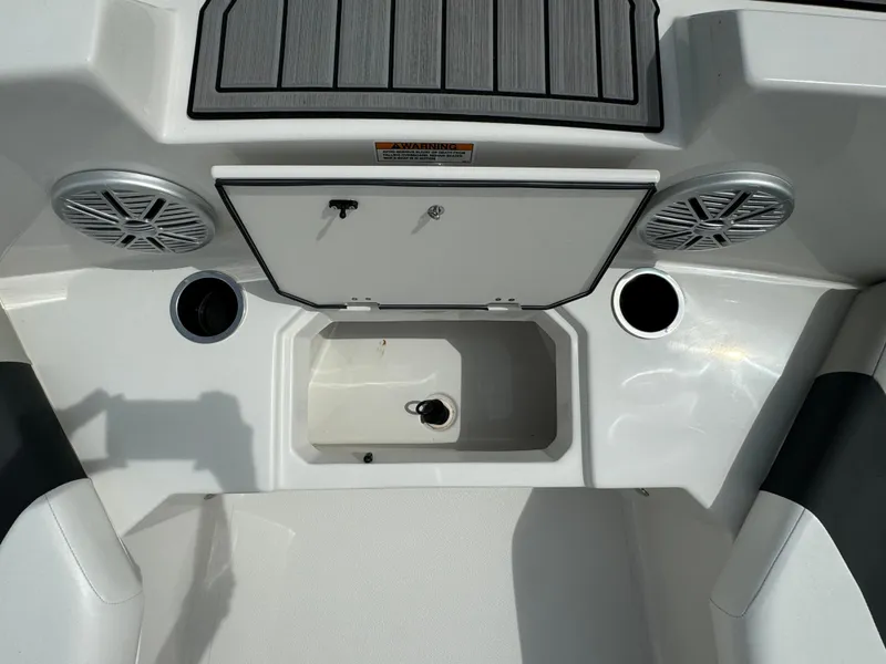 Slide: The Image of 2023 Starcraft SVX 171 OB boat interior with speakers and storage compartment. - 6