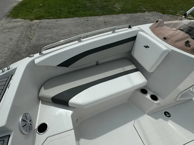 Slide: The Image of 2023 Starcraft SVX 171 OB boat interior with cushioned seating and cup holders. - 7