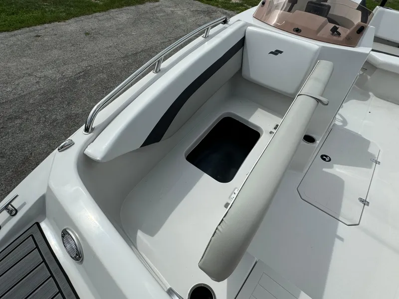 Slide: The Image of 2023 Starcraft SVX 171 OB boat interior with seating and storage compartment. - 8