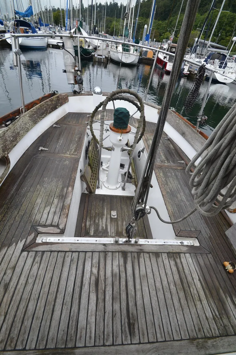 Slide: The Image of 1978 Cheoy Lee Offshore 32 sailboat with wooden deck at marina. - 12