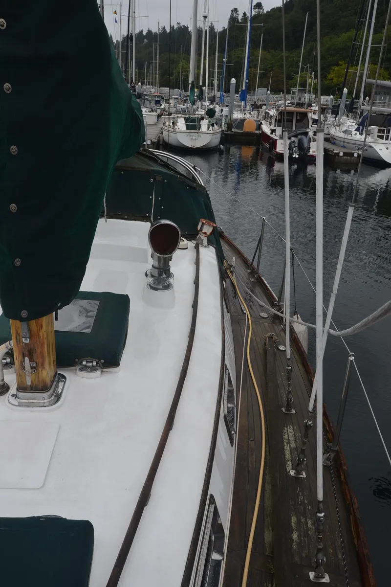 Slide: The Image of 1978 Cheoy Lee Offshore 32 sailboat docked in a marina. - 14