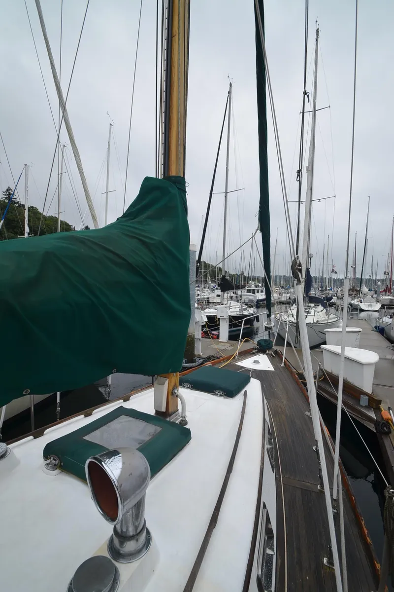 Slide: The Image of 1978 Cheoy Lee Offshore 32 sailboat docked in a marina, overcast sky. - 15