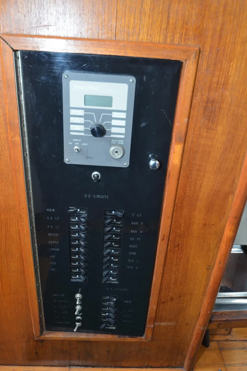 Slide: The Image of Electrical panel of 1978 Cheoy Lee Offshore 32 yacht with wooden finish. - 36