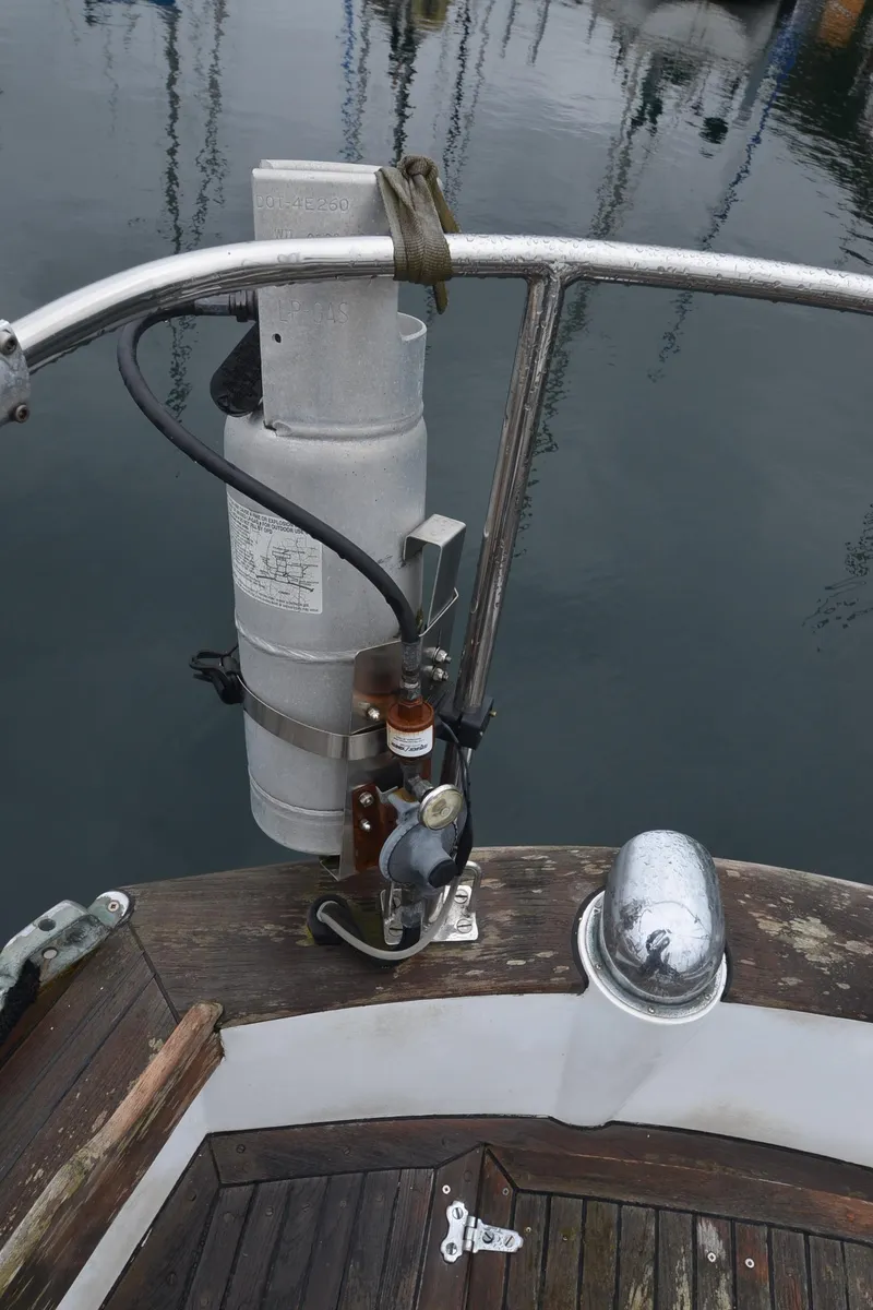 Slide: The Image of 1978 Cheoy Lee Offshore 32 sailboat deck with steering mechanism and railing. - 40