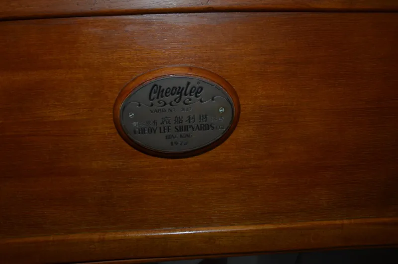 Slide: The Image of Cheoy Lee Offshore 32, 1978, shipyard plaque on wooden surface. - 48