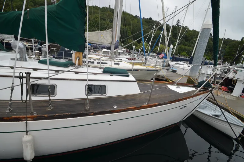 Slide: The Image of 1978 Cheoy Lee Offshore 32 sailboat docked in a marina. - 6
