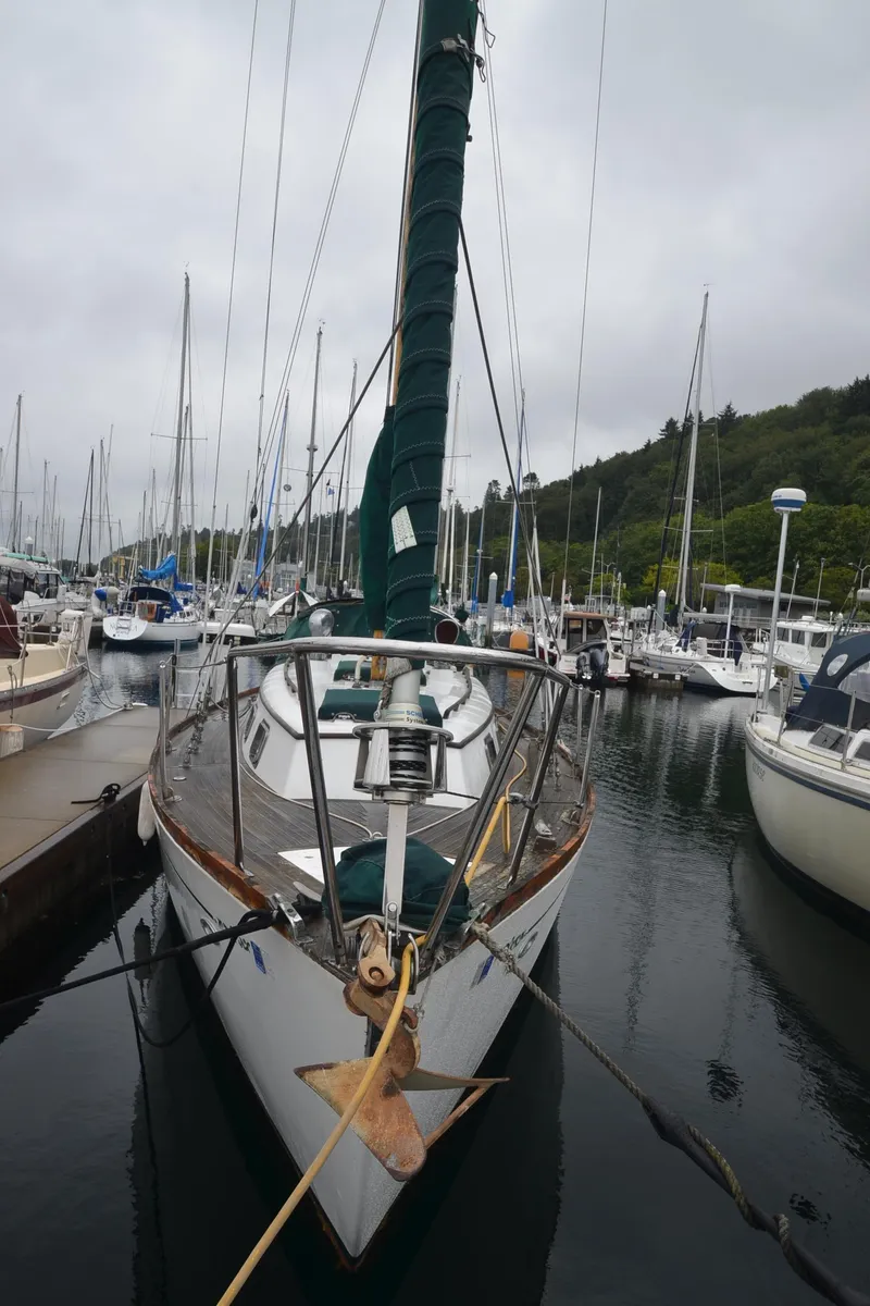 Slide: The Image of 1978 Cheoy Lee Offshore 32 sailboat docked in a marina. - 8