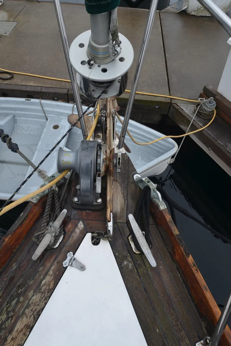 Slide: The Image of Bow of 1978 Cheoy Lee Offshore 32 sailboat with anchor winch and ropes. - 9