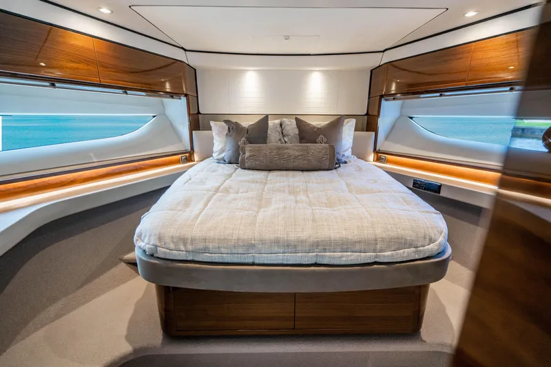 Slide: The Image of Luxurious bedroom interior of 2018 Princess F62 yacht with large bed and elegant wood finishes. - 11