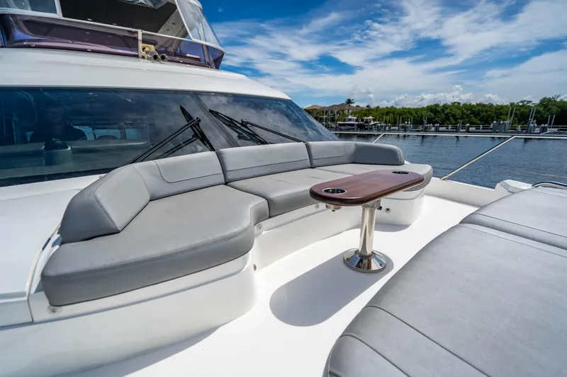 Slide: The Image of Luxurious seating area on 2018 Princess F62 yacht with scenic marina backdrop. - 15