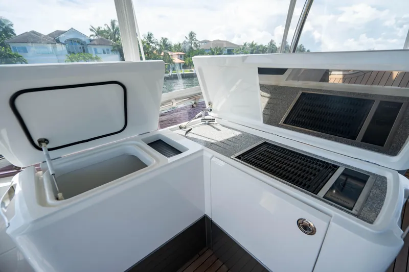 Slide: The Image of 2018 Princess F62 yacht outdoor kitchen with grill and storage compartments. - 17
