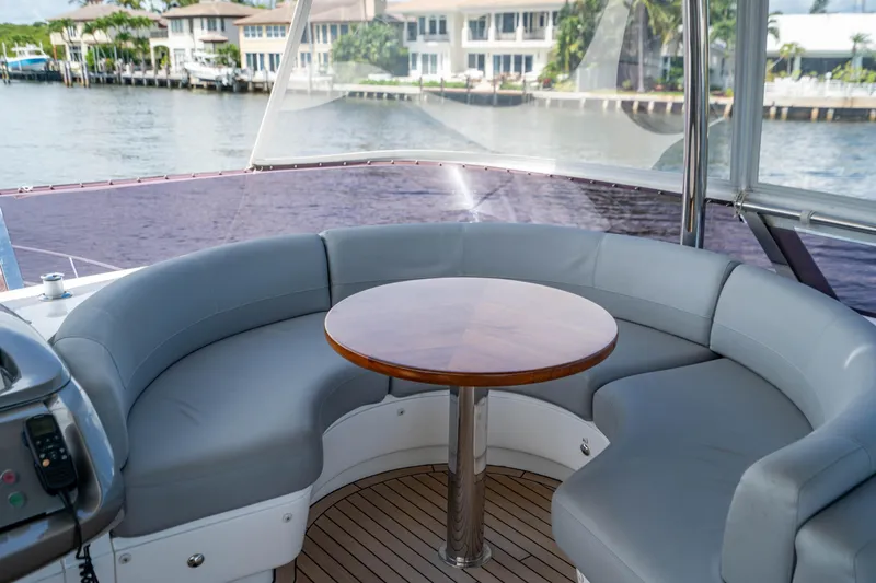 Slide: The Image of Luxurious seating area on a 2018 Princess F62 yacht with waterfront view. - 18