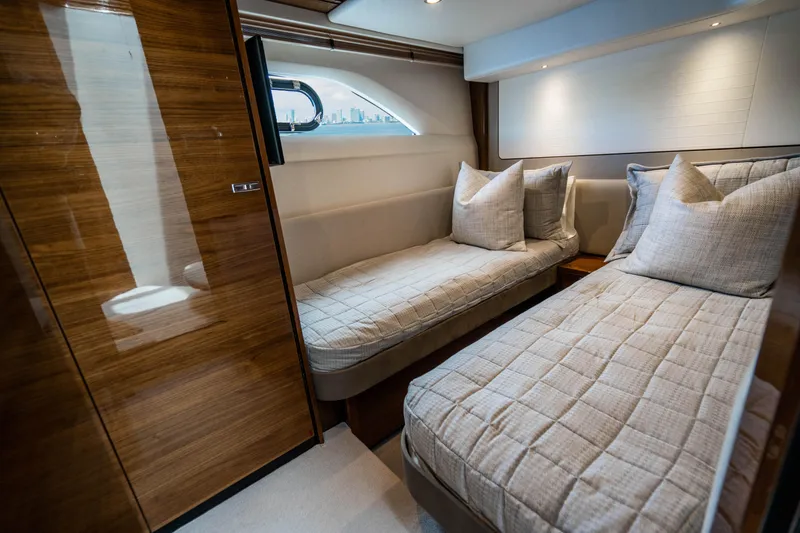 Slide: The Image of Luxurious twin cabin interior of 2018 Princess F62 yacht with modern decor. - 23