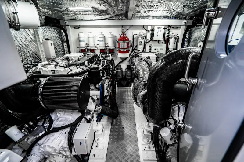 Slide: The Image of Engine room of a 2018 Princess F62 yacht with advanced machinery and fire safety equipment. - 27