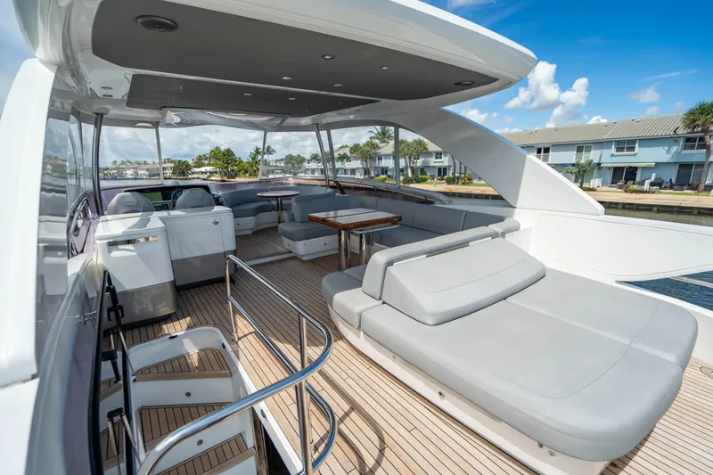 Slide: The Image of 2018 Princess F62 yacht with spacious deck and luxurious seating. - 3