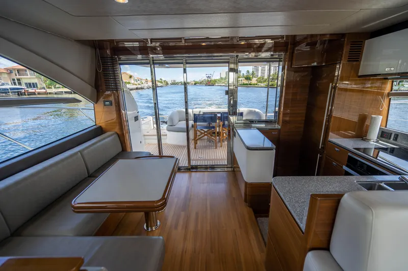 Slide: The Image of Interior of 2018 Princess F62 yacht with dining area and waterfront view. - 8