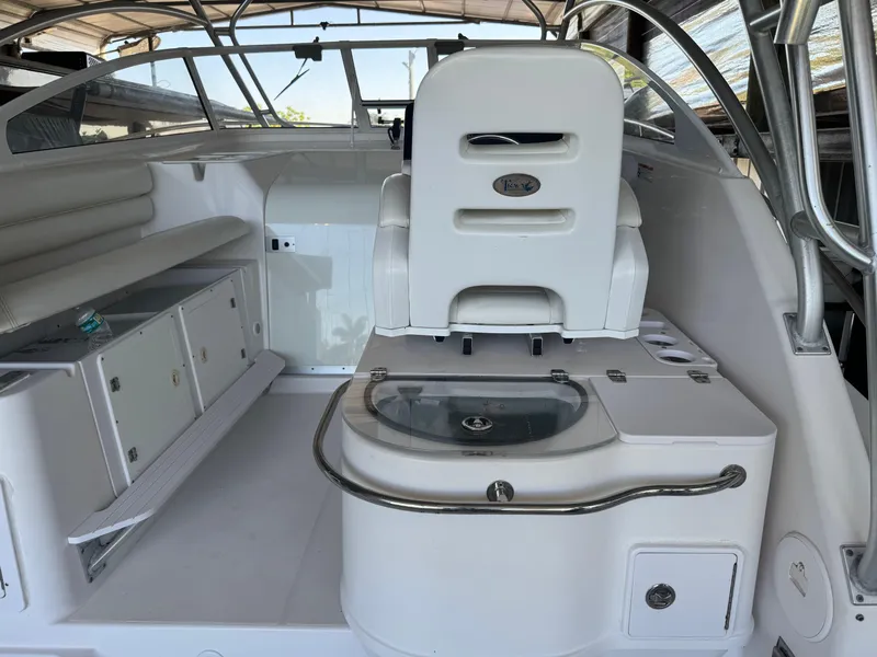 Slide: The Image of 2006 Pro-Line 32 Express boat interior with seating and storage compartments. - 12