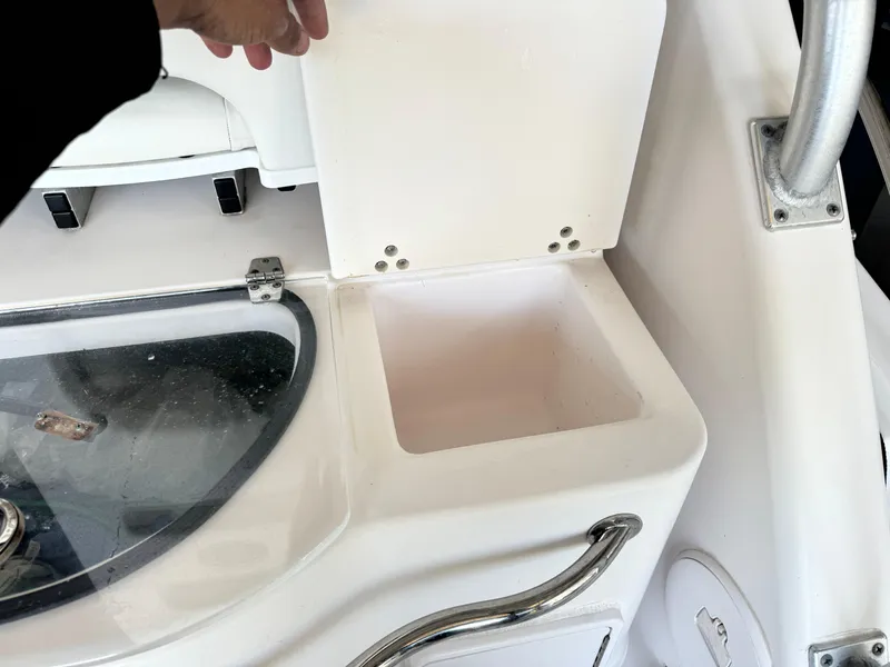 Slide: The Image of 2006 Pro-Line 32 Express boat interior detail with storage compartment and handle. - 13