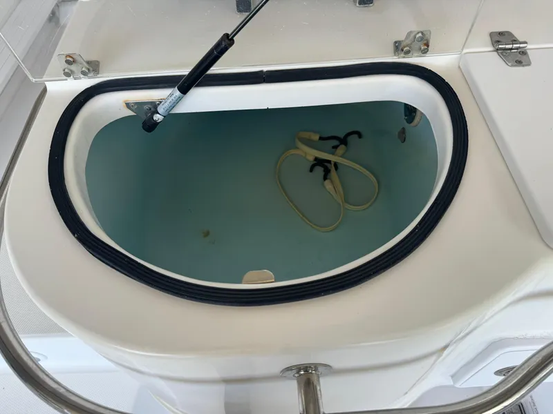 Slide: The Image of Livewell on 2006 Pro-Line 32 Express boat, open lid, showing interior. - 14