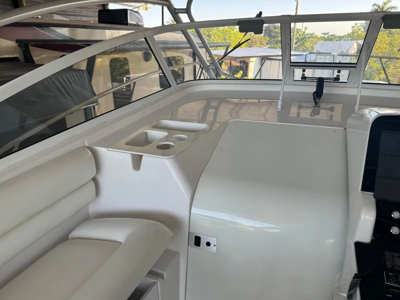 Slide: The Image of 2006 Pro-Line 32 Express boat interior with seating and console area. - 16