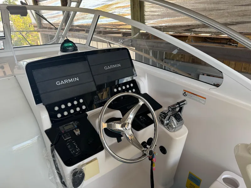 Slide: The Image of 2006 Pro-Line 32 Express boat helm with Garmin navigation system. - 17