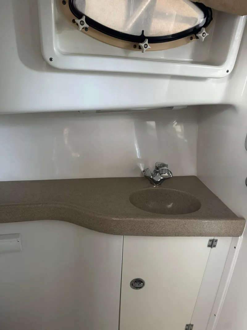 Slide: The Image of 2006 Pro-Line 32 Express boat interior with sink and countertop. - 19