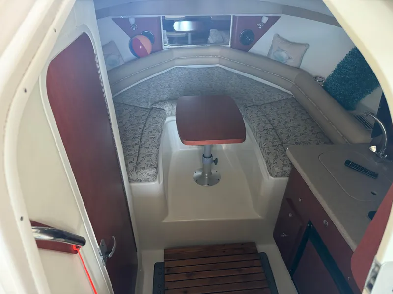 Slide: The Image of Interior of 2006 Pro-Line 32 Express boat with seating and table. - 24