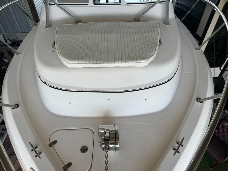 Slide: The Image of 2006 Pro-Line 32 Express boat deck with cushioned seating and anchor chain. - 27