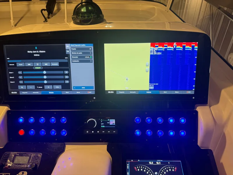 Slide: The Image of 2006 Pro-Line 32 Express boat dashboard with navigation and control screens. - 29