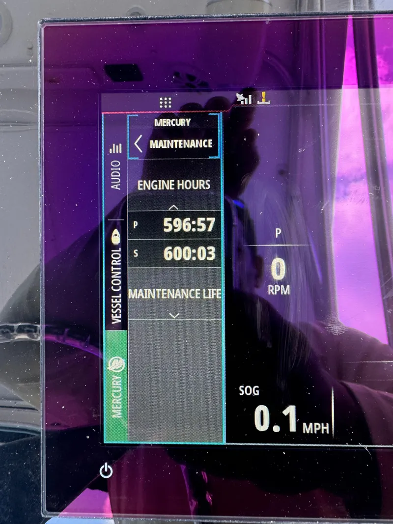 Slide: The Image of Boat engine display showing maintenance hours and speed for 2006 Pro-Line 32 Express. - 32