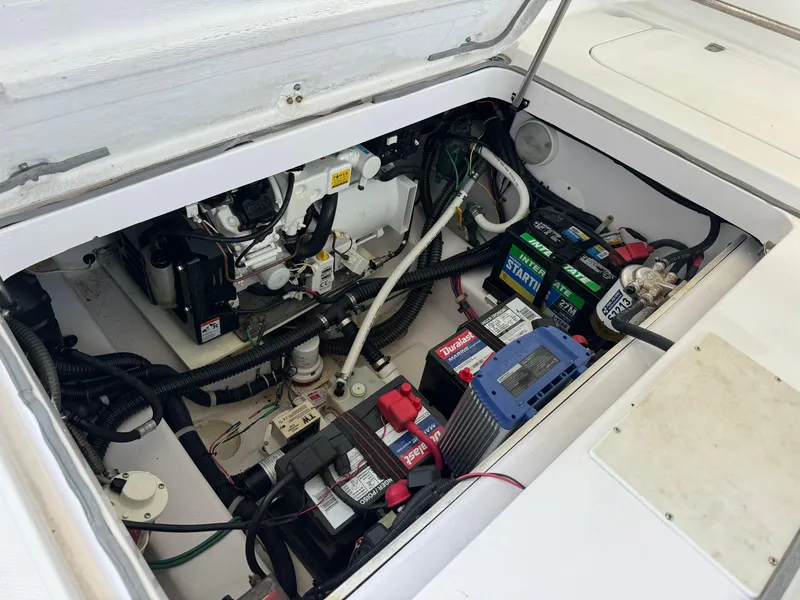 Slide: The Image of Engine compartment of 2006 Pro-Line 32 Express boat with batteries and wiring. - 9