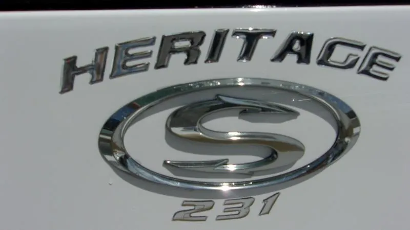 Slide: The Image of 2025 Sportsman Heritage 231 CC logo on boat exterior. - 3