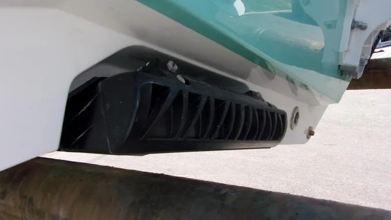 Slide: The Image of 2025 Sportsman Heritage 231 CC boat hull detail with black component. - 5