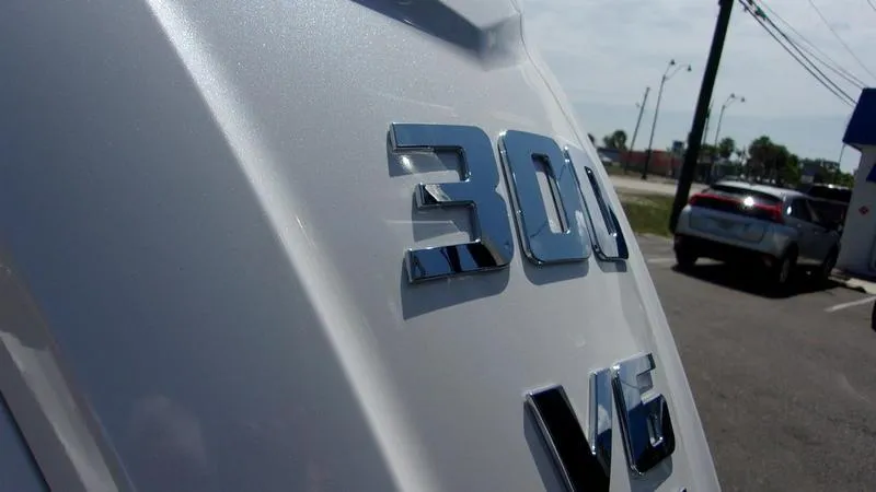 Slide: The Image of Close-up of 300 V6 engine emblem on 2025 Sportsman Heritage 231 CC boat. - 6