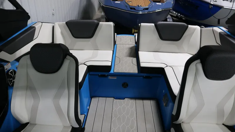 Slide: The Image of 2023 Yamaha Boats 222XD interior with white and black seating, showcasing modern design. - 10