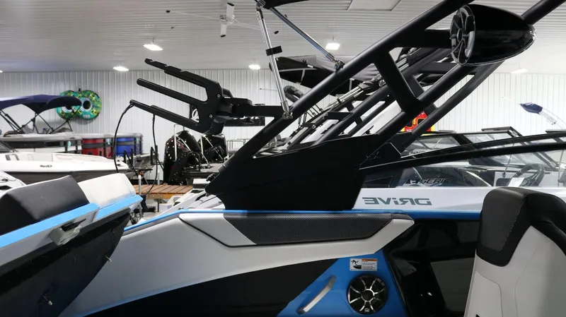 Slide: The Image of 2023 Yamaha Boats 222XD interior with sleek design and modern features in showroom. - 16