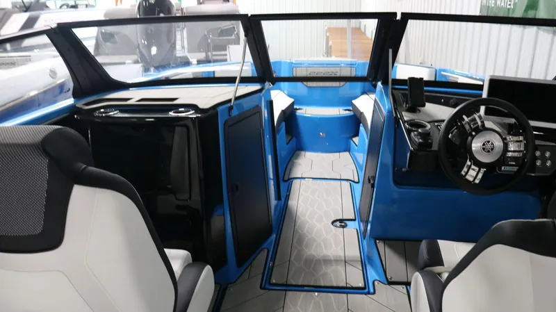 Slide: The Image of 2023 Yamaha Boats 222XD interior with modern dashboard and seating. - 17