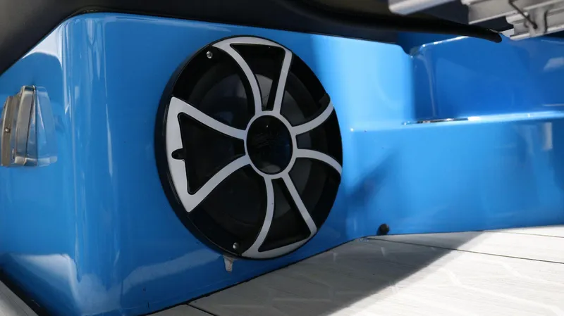 Slide: The Image of 2023 Yamaha Boats 222XD speaker on blue deck, close-up view. - 24
