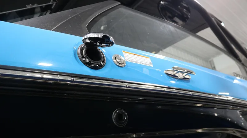Slide: The Image of 2023 Yamaha Boats 222XD, close-up of blue and black exterior detailing. - 33