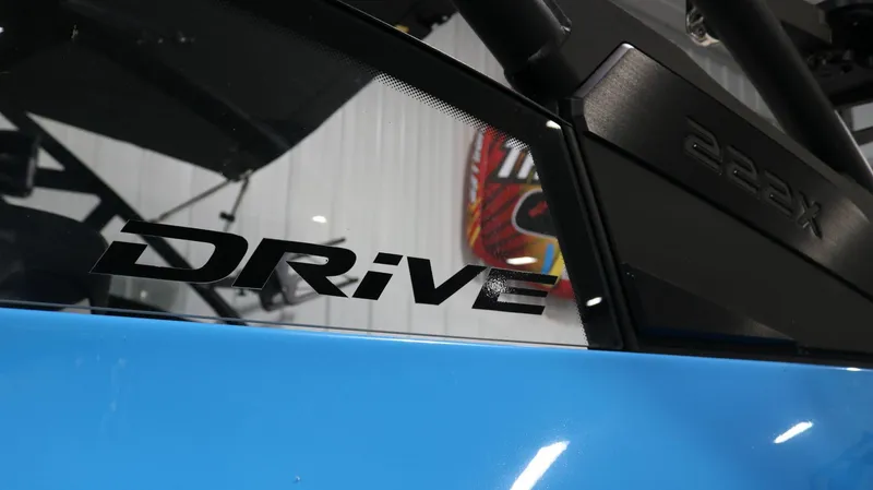 Slide: The Image of 2023 Yamaha Boats 222XD with "Drive" decal on blue exterior. - 34