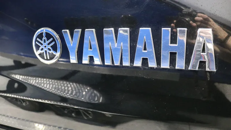 Slide: The Image of Yamaha logo on 2023 Yamaha Boats 222XD, featuring reflective chrome lettering. - 35