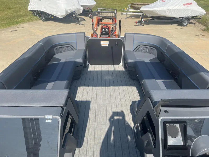 Slide: The Image of 2023 Manitou Explore 24 Switchback pontoon boat interior with spacious seating. - 10