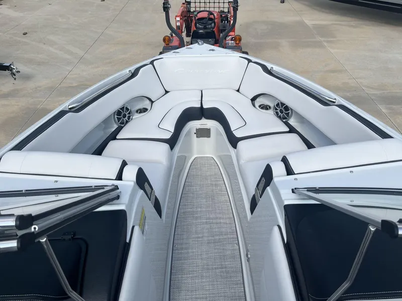 Slide: The Image of 2024 Crownline 240SS boat interior with white seating and modern design. - 11