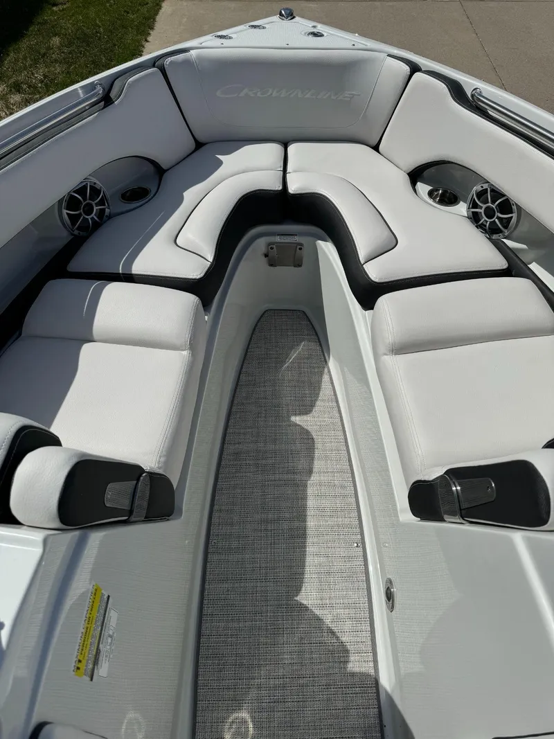 Slide: The Image of 2024 Crownline 240SS boat interior with plush seating and modern design. - 12