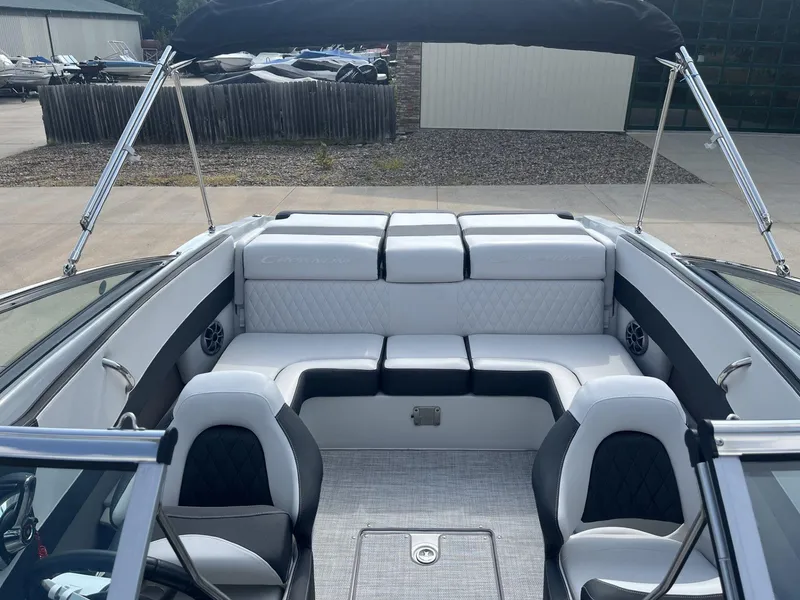 Slide: The Image of 2024 Crownline 240SS boat interior with luxurious seating and modern design. - 13