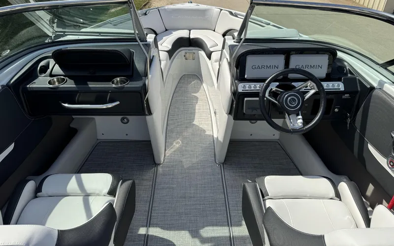 Slide: The Image of 2024 Crownline 240SS boat interior with Garmin displays and modern seating. - 14