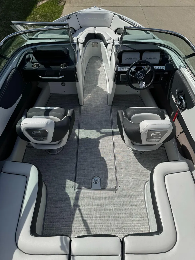 Slide: The Image of 2024 Crownline 240SS boat interior with modern seating and Garmin navigation system. - 20