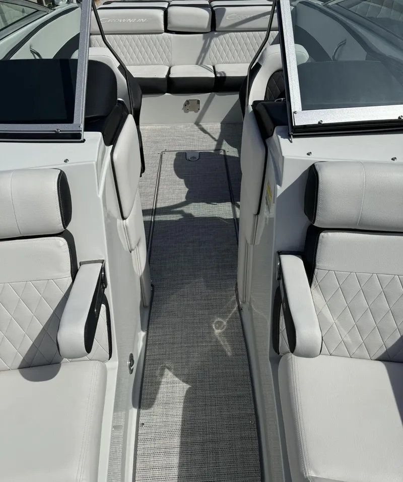 Slide: The Image of 2024 Crownline 240SS boat interior with luxurious seating and modern design. - 21