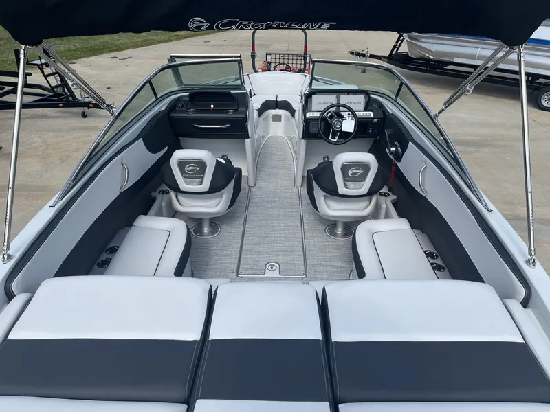 Slide: The Image of 2024 Crownline 240SS boat interior with sleek seating and modern dashboard. - 7
